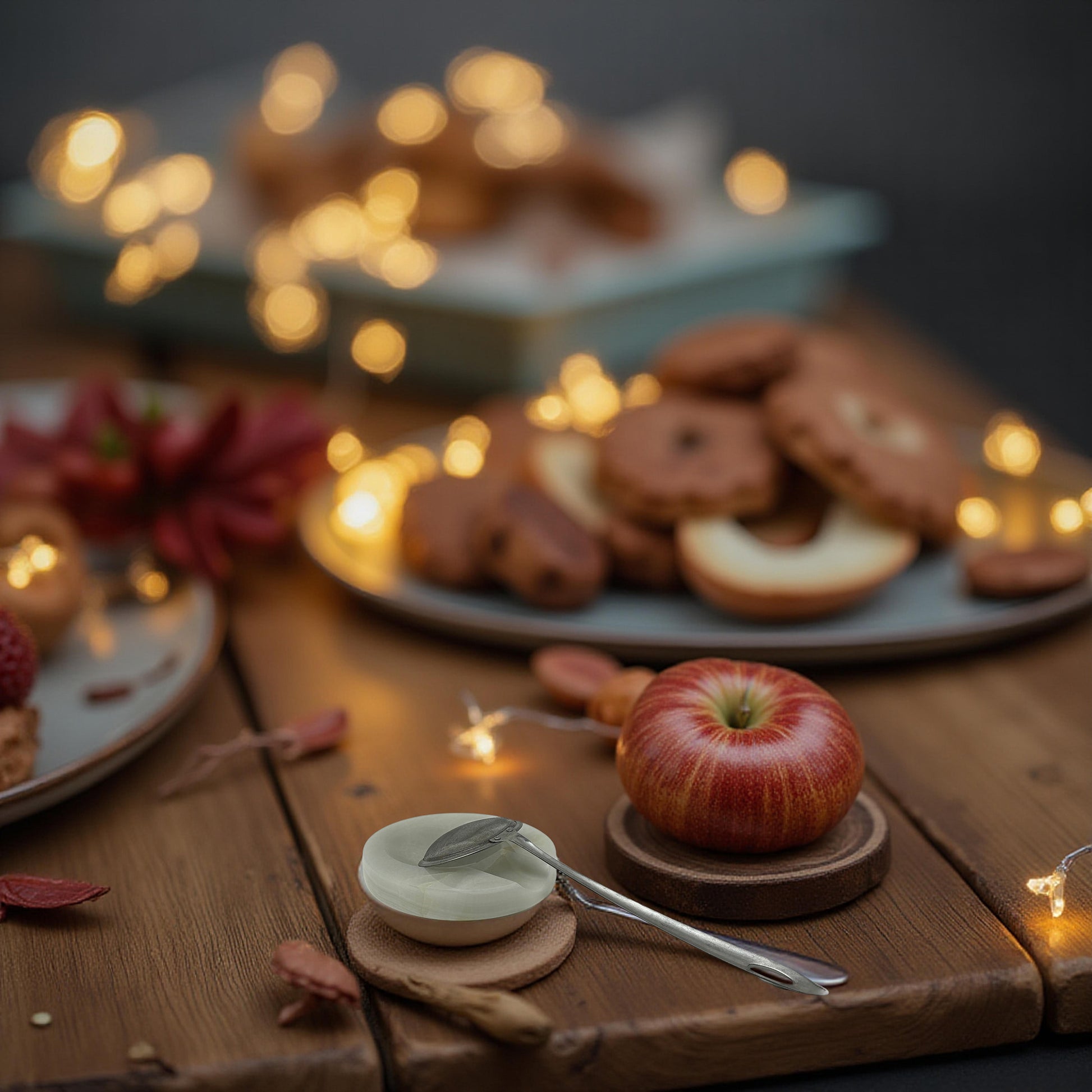 Onyx spoon rest with spoon beside cookies and string lights