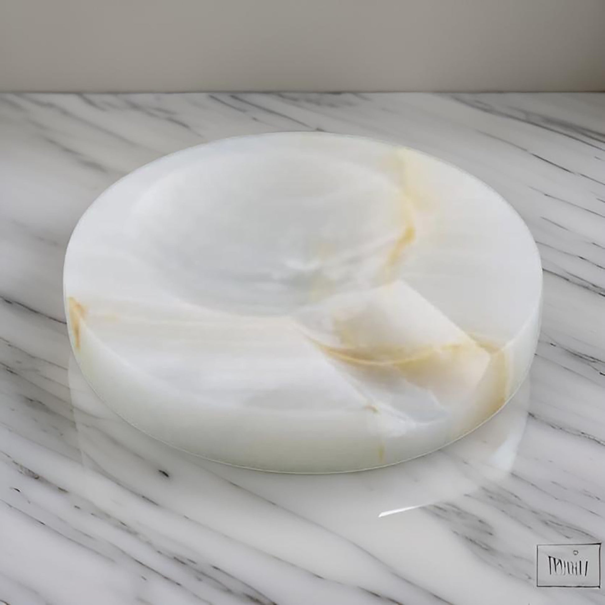 Close-up view of the onyx spoon rest showcasing its natural veining